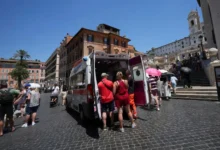 Paramedics provide aid to tourists and residents with an ambulance